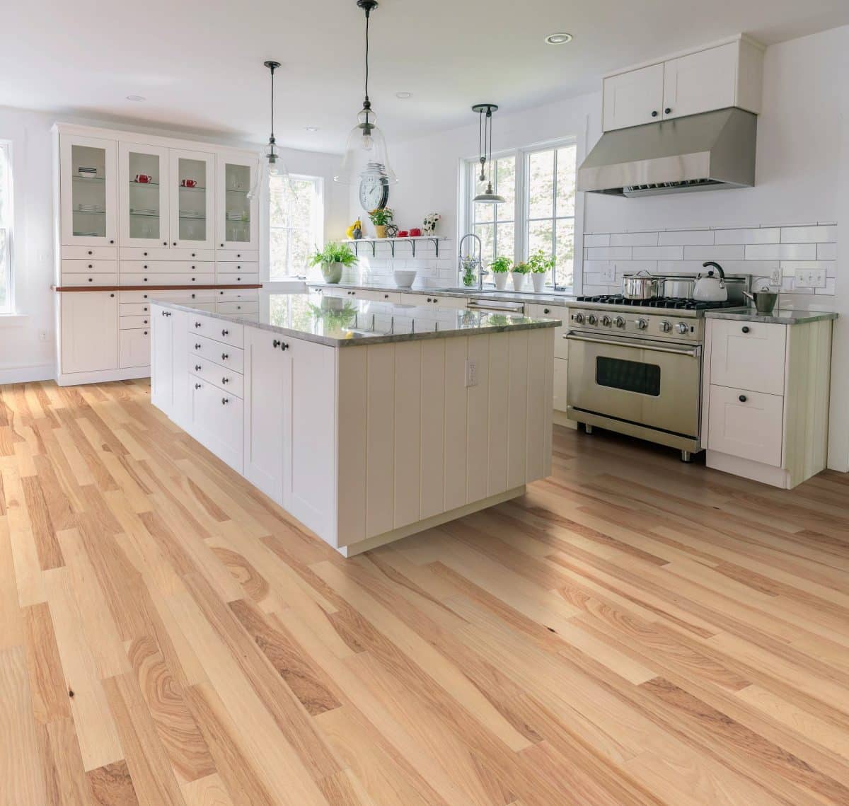 Room scene featuring 3" wide hickory engineered hardwood floor in a living room